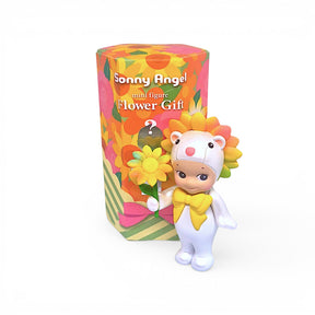 Flower Gift mini figure with yellow bow and orange flower, beside colorful gift box