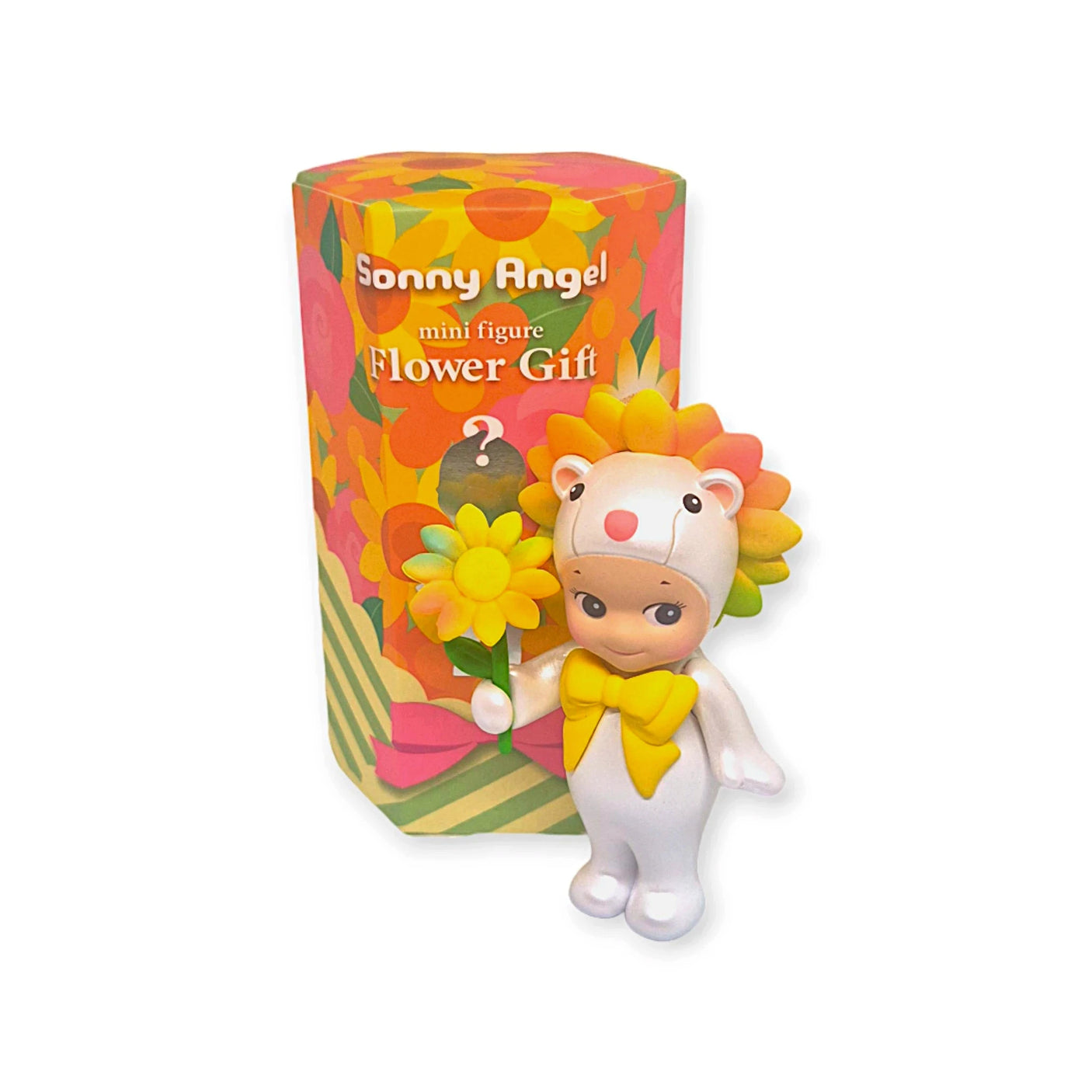 A small figurine from the Sonny Angel Flower Gift Series, dressed in a flower-themed suit, stands beside colorful packaging labeled "Sonny Angel Flower Gift Series," making it an ideal collectible gift.