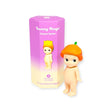 A small figure adorned with an orange flower hat is positioned next to a purple blind box labeled "Sonny Angel Flower Series," highlighting the charming collection of floral figures from Sonny Angel.