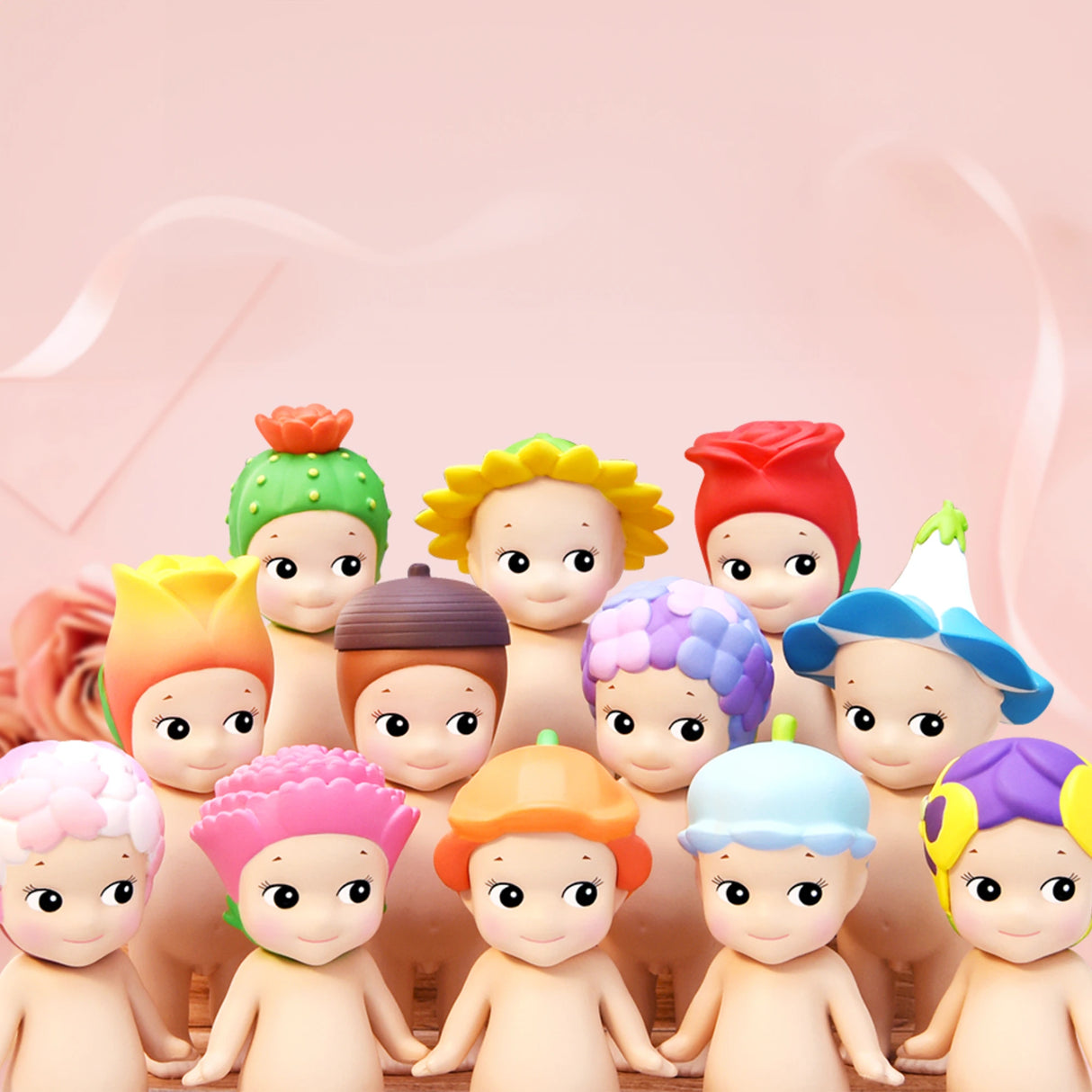 Twelve characters from the Sonny Angel Flower Series by Sonny Angel feature distinct flower-themed hats and are arranged in rows, characterized by their round eyes and neutral expressions. Their charm is amplified against a soft pink background, making these delightful collectibles, available in a blind box, even more appealing.