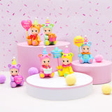 The Sonny Angel Birthday Bear Gifts, by Sonny Angel, feature charming bear-themed figurines adorned with party hats and holding "Happy Birthday" signs, all set on round pink and white bases. Accented with pastel pom-poms, these enchanting collectibles are the ideal festive gift.