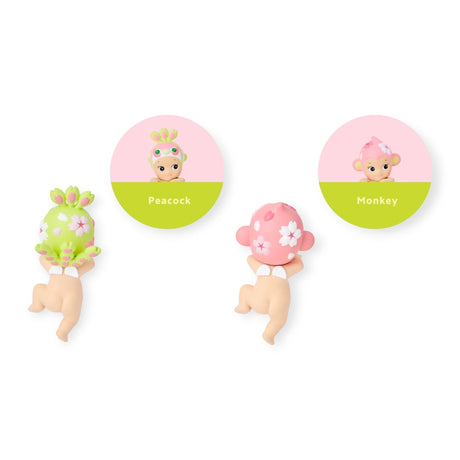 Hippers collectible figures with peacock and monkey designs, pink floral headpieces