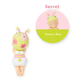 Bee-themed Hippers collectible figure with yellow-green hood, antennae, and flower details