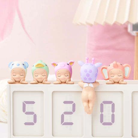 Part of the whimsical Sonny Angel Hippers Blind Box - Dreaming from Sonny Angel, five adorable baby figurines in animal costumes perch atop a digital display showing the number 520.