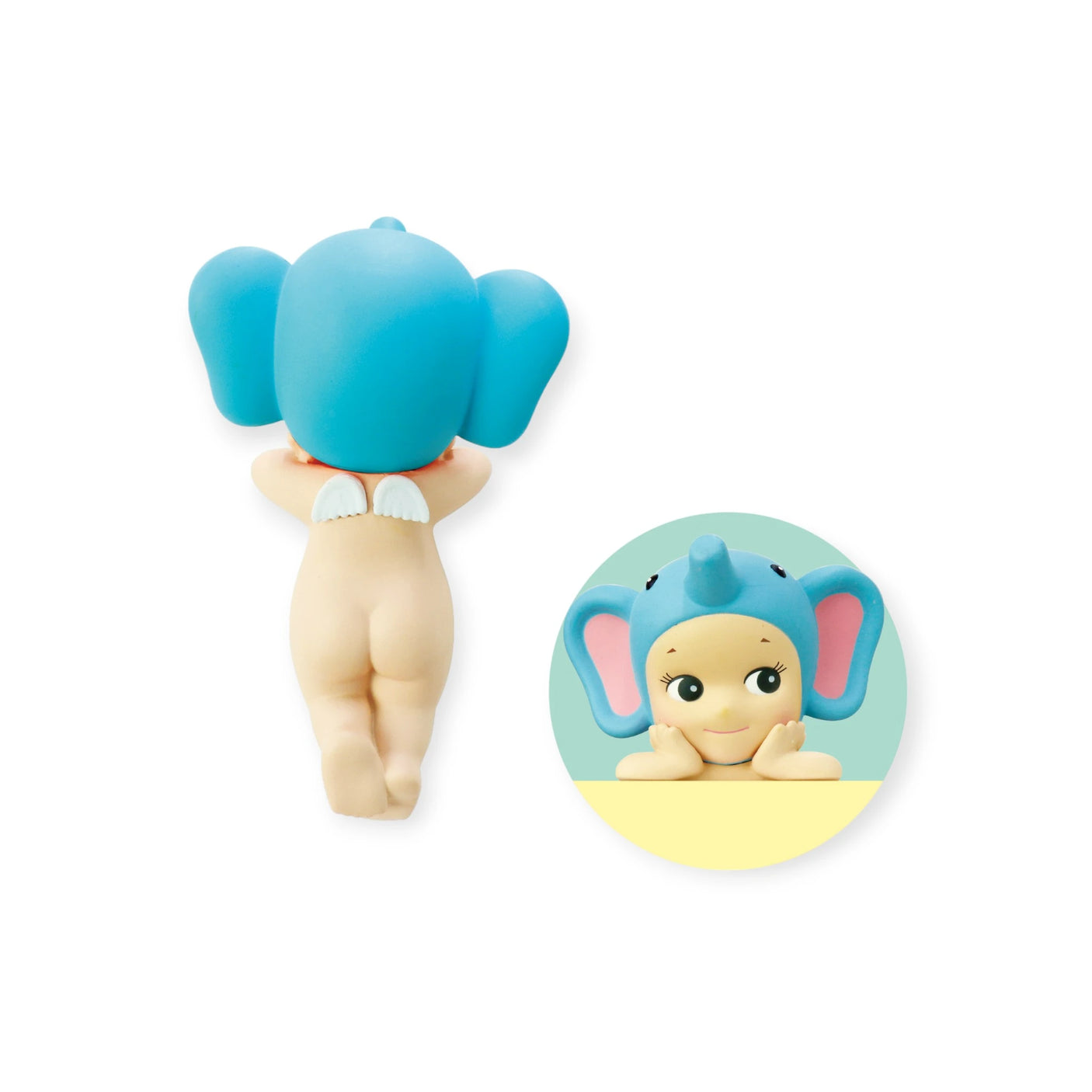 The Sonny Angel Hippers Blind Box - Animals by Sonny Angel features a cherub cartoon character wearing a blue elephant hat, with wings and a bare back. The inset shows its smiling face with large ears on a light background. Ideal for collectors or as an enchanting accessory with its reusable adhesive.