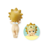 On the left, a small figurine from the Sonny Angel Hippers Blind Box - Animals by Sonny Angel is shown from the back, displaying its hedgehog-like spiky hair. On the right, a close-up of its face in a round frame highlights its unique details, securely held with reusable adhesive for easy display.