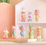 A display features the Sonny Angel Home Sweet Home Series by Sonny Angel, showcasing a variety of small, colorful figurines dressed in animal-themed costumes and surrounded by cozy companions.