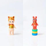 Featuring two whimsical figures from the Sonny Angel Japanese Good Luck series, one is dressed in a lion costume while the other takes form as a red creature perched on colorful blocks. These delightful Sonny Angel creations embody the essence of Japanese Lucky Charms, infusing any collection with good fortune and playful charm.