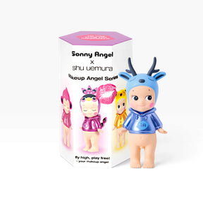 Makeup Angel blind box with blue bunny-capped figure in front of character packaging