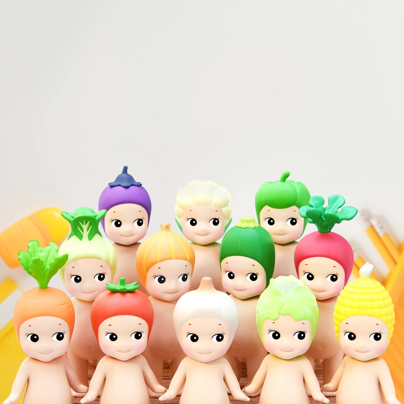 Rows of figurines wearing different vegetable-themed hats are displayed, each being a part of the Sonny Angel Vegetable Series Blind Box collection. Every figure showcases a distinct hat inspired by various vegetables or fruits, providing an element of delightful surprise similar to typical blind box figures.