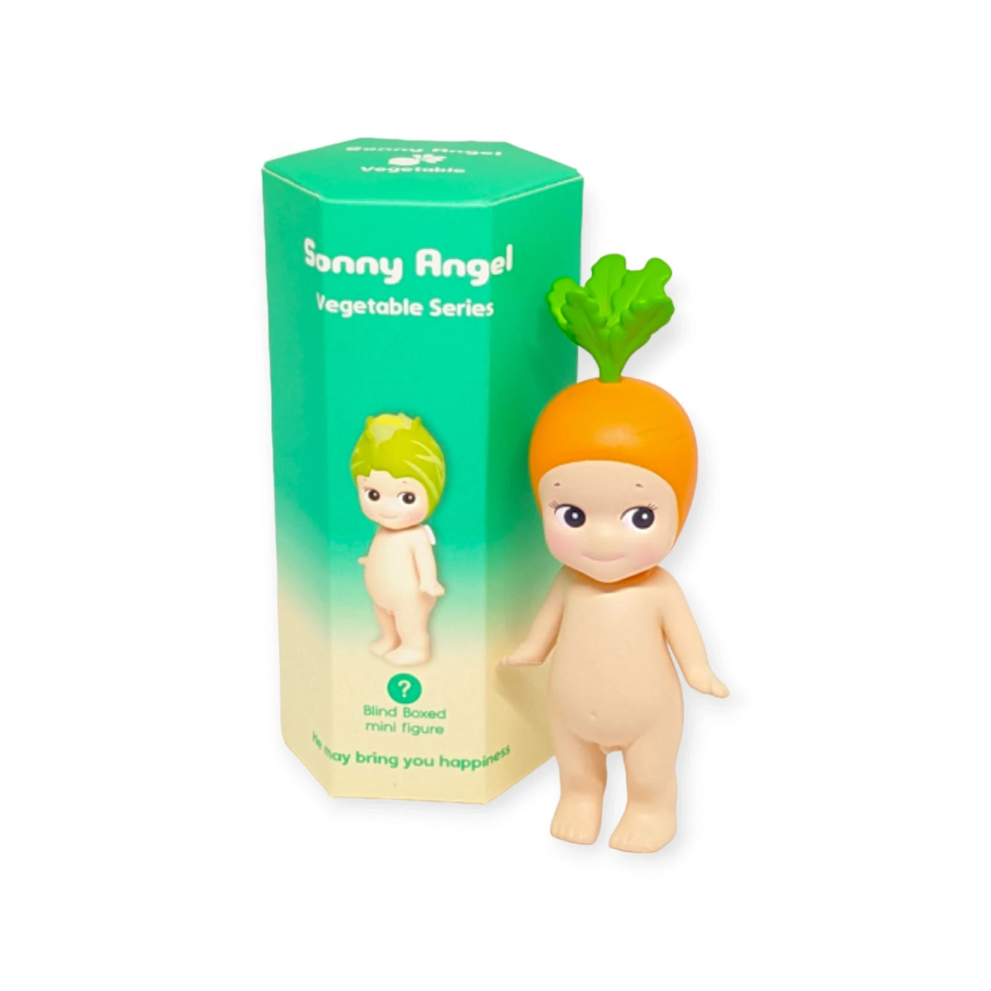 A small doll with a carrot hat is placed beside a coordinating green and orange box marked as the "Sonny Angel Vegetable Series Blind Box" from the charming blind box figures collection by Sonny Angel.