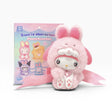 Plush bunny keychain in pink outfit with bunny-ear hood, shown in product packaging.