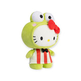 This cute Hello Kitty Plush - Keroppi Costume showcases Hello Kitty dressed in a green costume with large eyes on top and an endearing red bow. It features a white and red striped dress adorned with a black bow tie, making it an ideal addition to any Sanrio favorites collection.