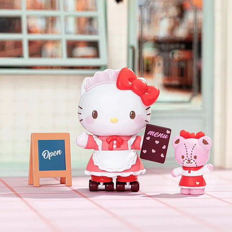 Small white cat figurine in a pink maid outfit holding a menu, standing beside a pink bear character and an open signboard