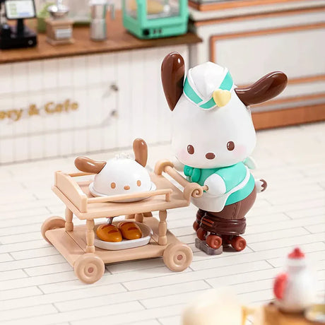 Dog figurine in a teal and white outfit on roller skates pushing a cart with a food-themed character and desserts