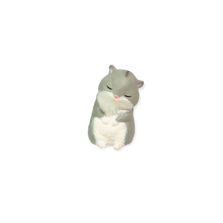 A delightful figurine of a small sleeping hamster, featuring closed eyes, gray fur, and a white belly, sitting upright against a plain white background. This charming piece from Yell's Sleepy Animals Blind Box is perfect for collectors of Relaxing Desk Friends.