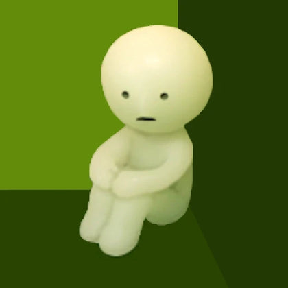 Hugging Knees figure from the Smiski Series 1 Lineup