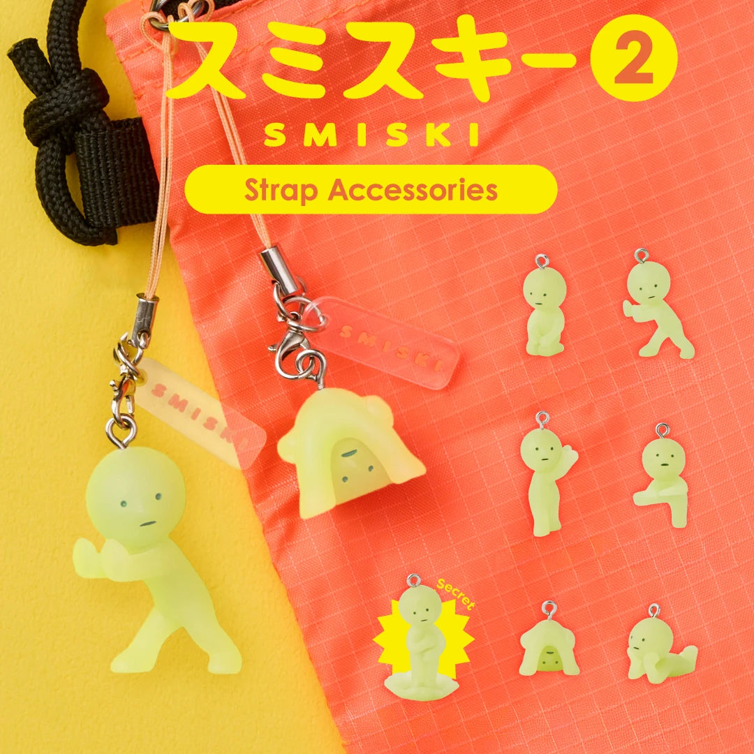 Two Smiski Strap Accessory Keychain - Series 2 items by Smiski hang from a coral bag, while eight collectible mini figures from the series are displayed on a yellow background, with Japanese and English text above.