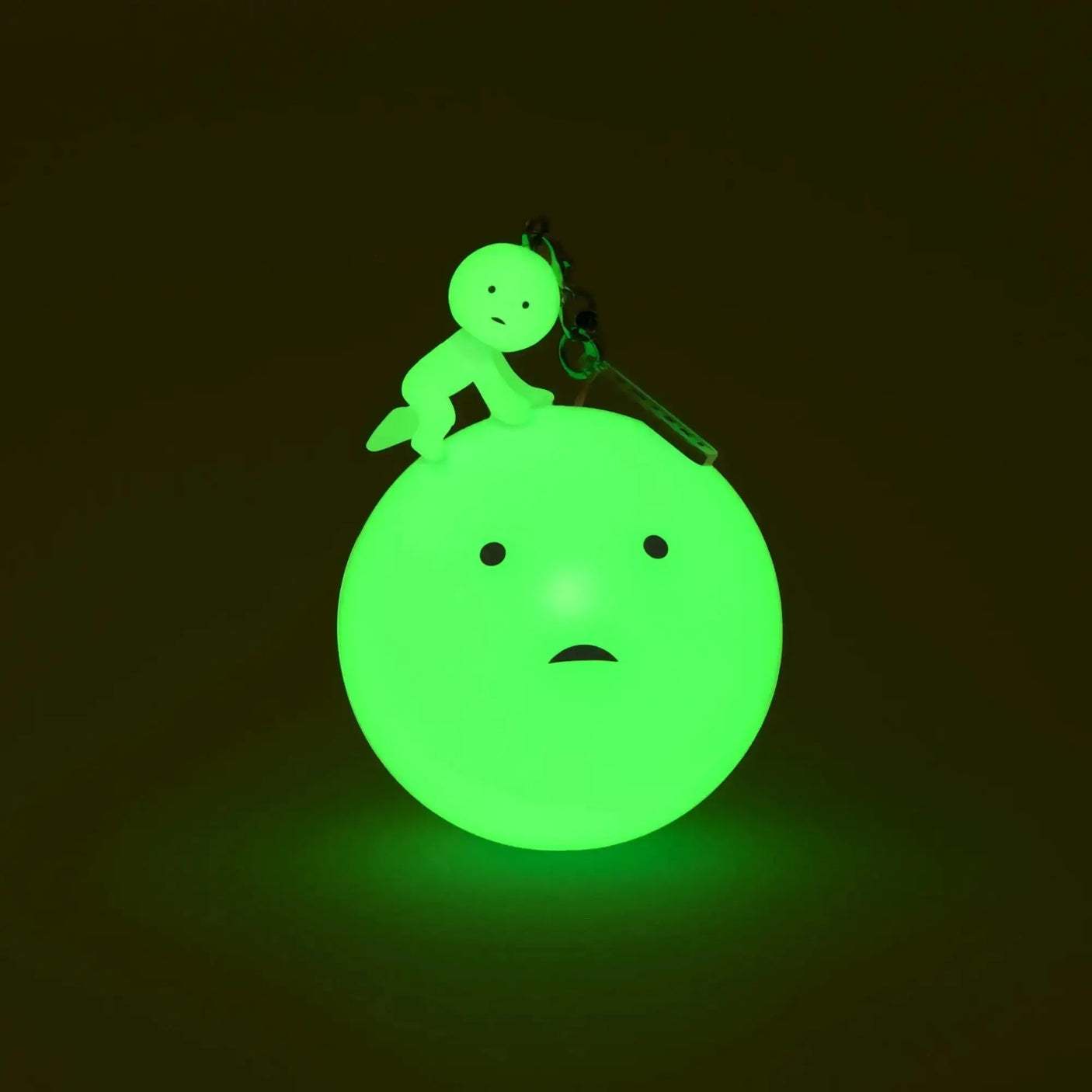 Green Smiski strap accessory keychain with clip, round body and small face