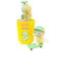 Two pastel Smiski Sunday Series - Blind Box figurines: one with a cup on a yellow box, another skateboarding in a green cap. These glow-in-the-dark Smiski collectibles bring playful charm to any space.