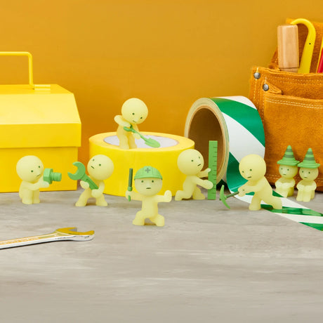 Group of small yellow-green construction figures with green hard hats and tools