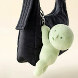 Light green Smiski plush keychain with hanging metal key ring and chain