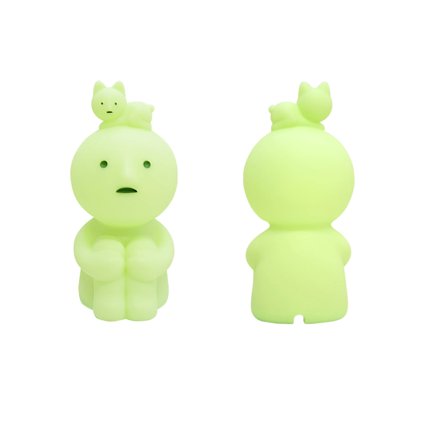 Two glow-in-the-dark Smiski Touch Light figurines are included: one with a concerned expression facing the front, and the other facing away. Each figurine is topped with a small cat that enhances its charm while also serving as a nightlight that activates with just a touch.