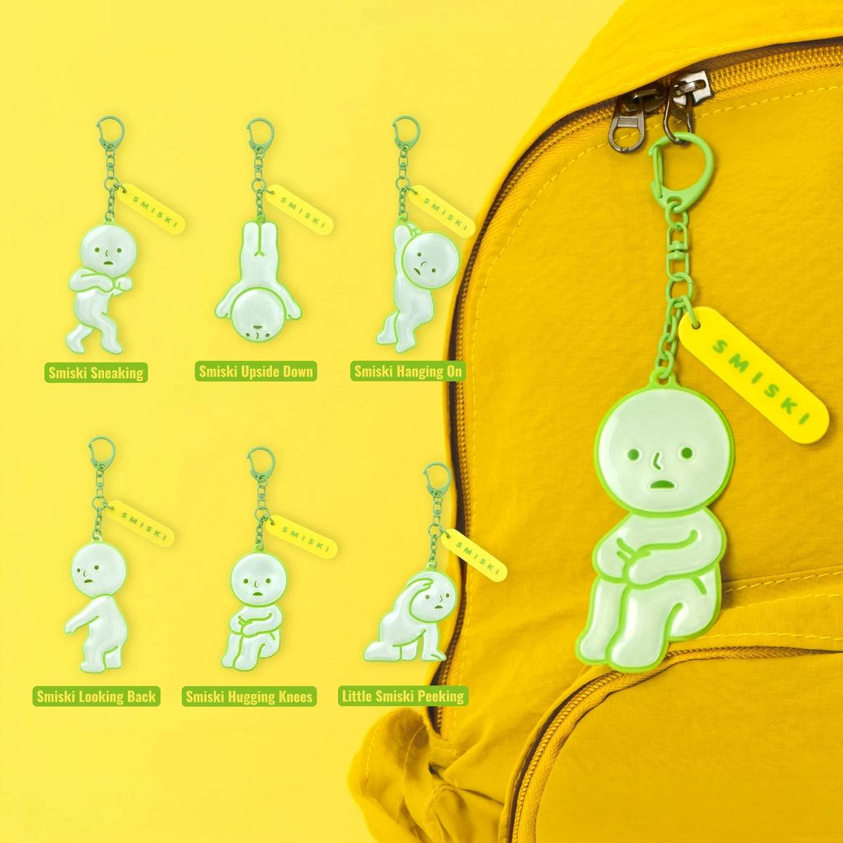 Set of green reflective Smiski charm keychains with chains and tabs