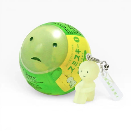 Smiski-style figure keychain attached to a green ball charm