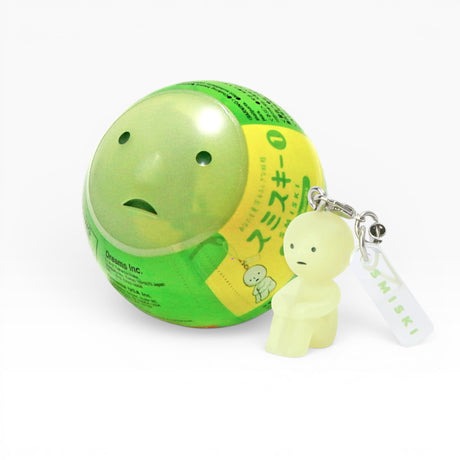 Green character strap keychain with small figure and white label tag