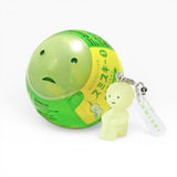 Smiski-style figure keychain attached to a green ball charm