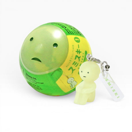 Green character strap keychain with small figure and white label tag