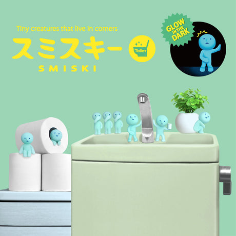 Smiski Toilet Series - Blind Box figures are arranged on and around a bathroom sink, mingling with toilet paper rolls. These tiny creatures from Smiski, known as mini figures collectibles, love to reside in corners, adding a whimsical glow to your bathroom decor.