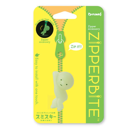 The packaging for this glow-in-the-dark accessory, designed as a small green figure hanging onto your zipper, features the phrases "Smiski ZipperBite - Hanging On" and "Zip it!" along with simple installation instructions. It's perfect for adding a touch of fun to your zippers!