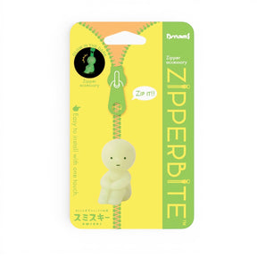 Zipper pull accessory with small green character figure, in Dream packaging
