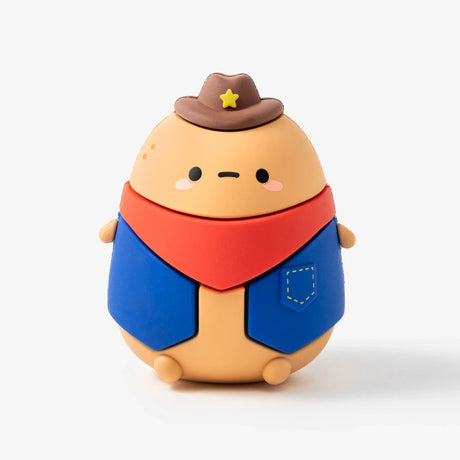 Round beige character figurine dressed as a cowboy with brown hat, red bandana, and blue vest on white background