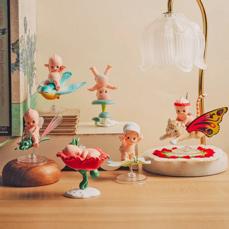 Kewpie In Nature blind box figurines display: multiple baby and animal figures on table