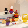 Assorted rabbit character figurines in different outfits on a display surface