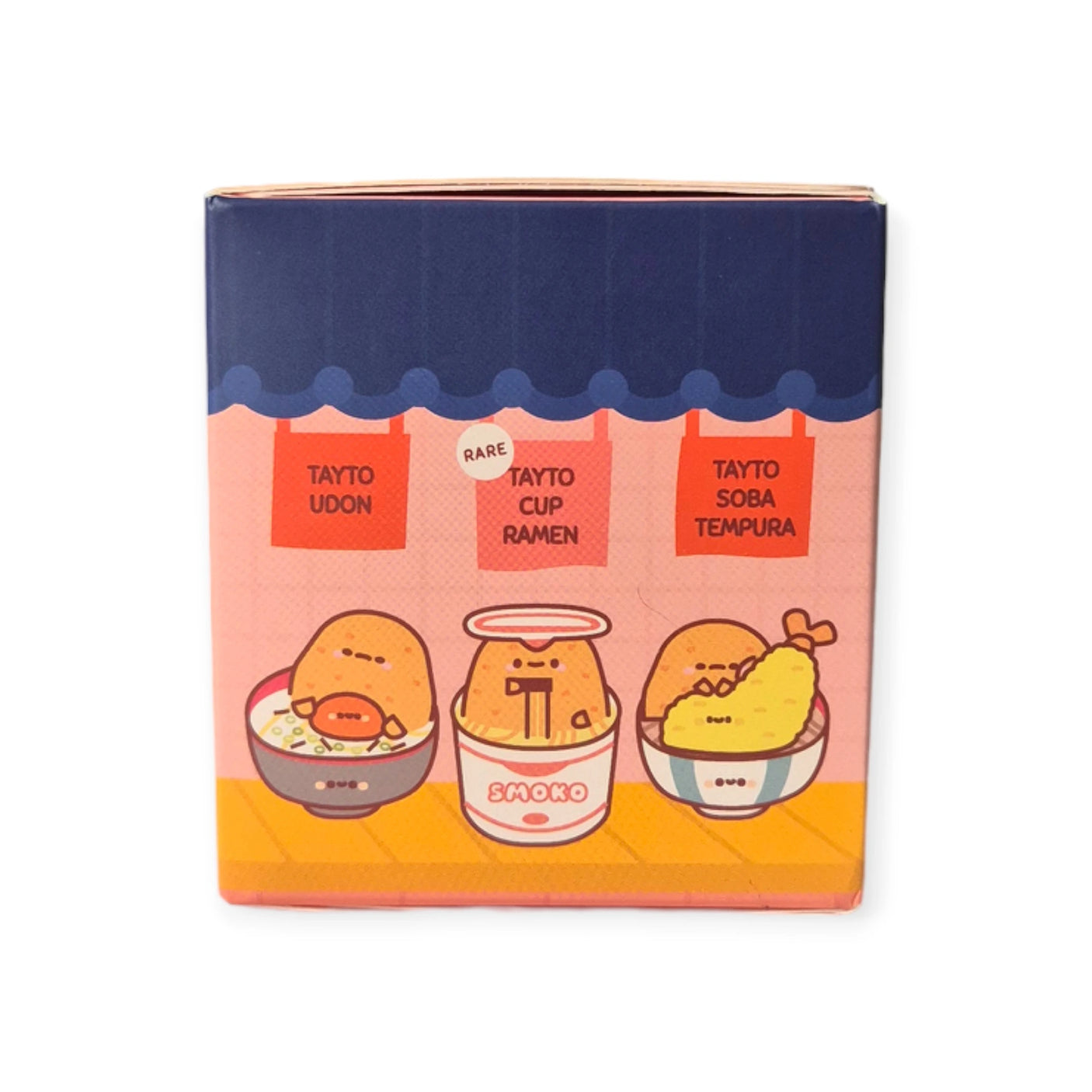 The packaging for the Smoko Tayto Potato Ramen Blind Box is beautifully illustrated and showcases three adorable cartoon food items: Tayto Udon, Tayto Cup Ramen, and Tayto Soba Tempura. Each dish highlights the endearing Smoko Tayto Potato characters, adding a playful element to your culinary collection.