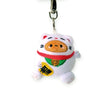 The Smoko Tayto Potato Lucky Cat Keychain Plushie showcases a white cat with an orange nose and pink ears, complemented by a red collar and green bib. Its charm is enhanced by holding a yellow plaque with black symbols, making it an ideal lucky charm for your everyday adventures.