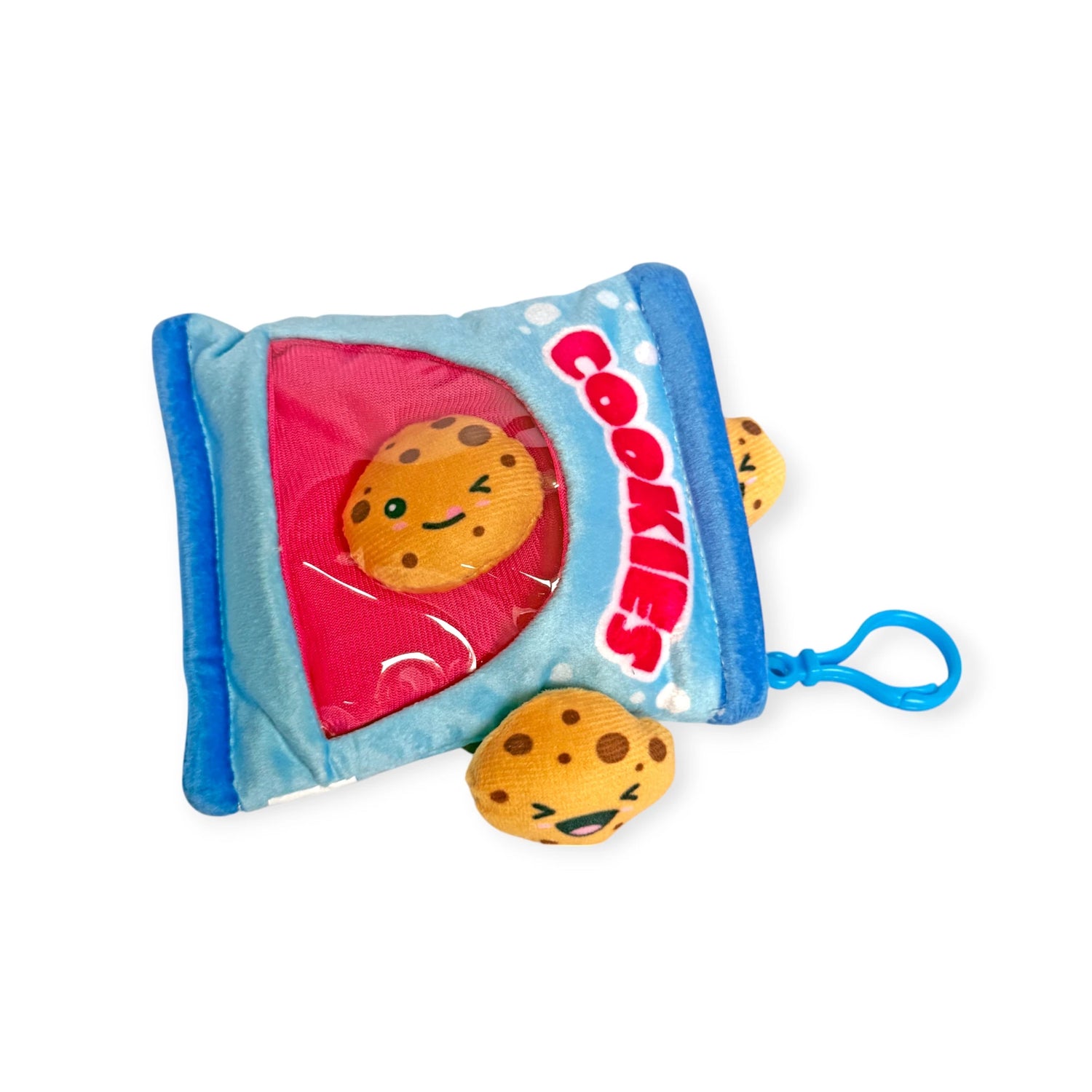 Bensons' Snack Bites Bag Charm is a plush toy styled as a cookie packet with smiling cookie faces and one playfully peeking out. Ideal for those who adore whimsical delights!.