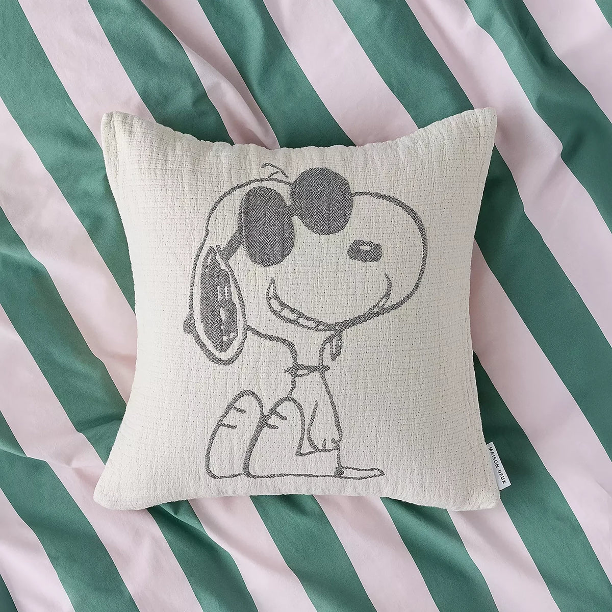 Cream cotton cushion cover with Snoopy waving graphic in gray line art