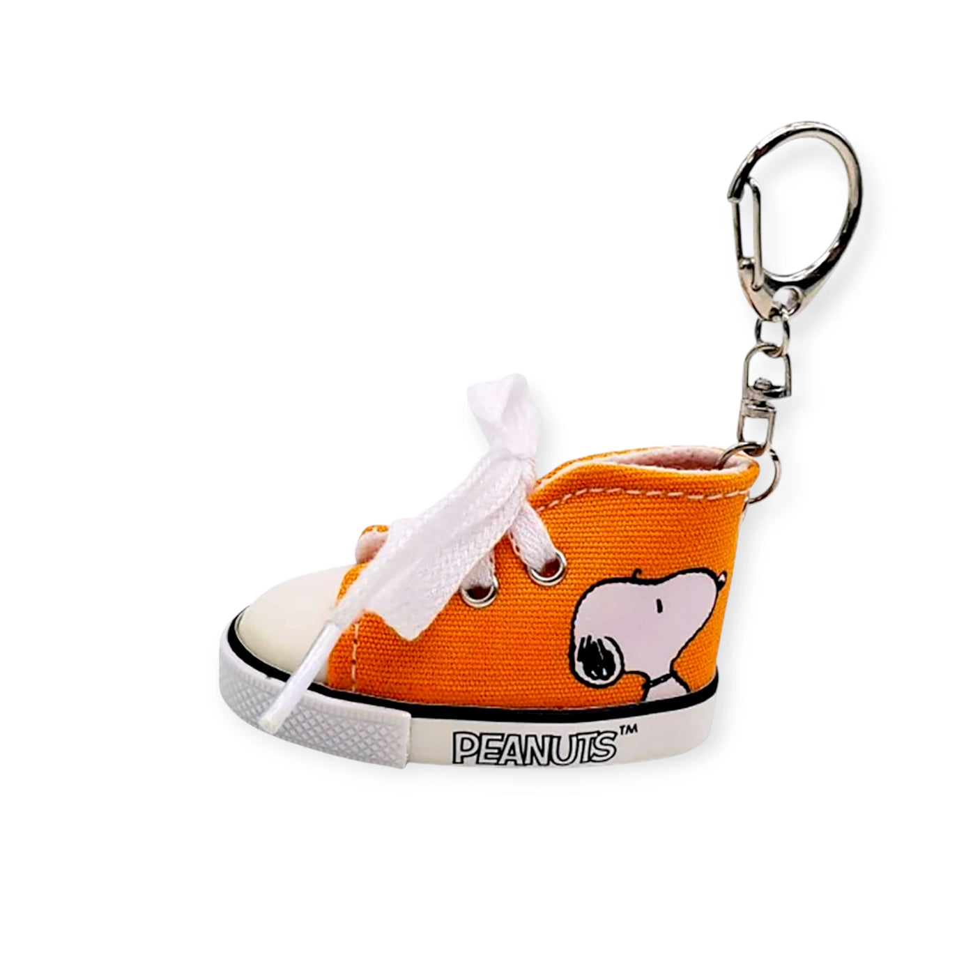 The Snoopy Orange Kicks Keychain is perfect for Peanuts fans with its playful sneaker-shaped Snoopy design and white laces, featuring a sturdy metal clasp for easy attachment.