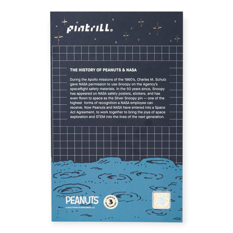 Peanuts NASA history pin backer card with dark grid and blue space illustration