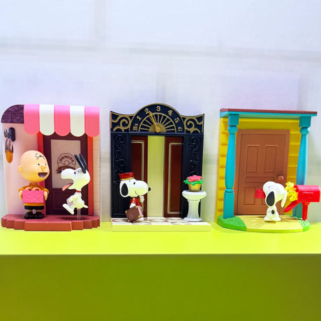 Zoomed view of three unique Snoopy Door Story blind box scenes featuring colorful doorways and Peanuts characters