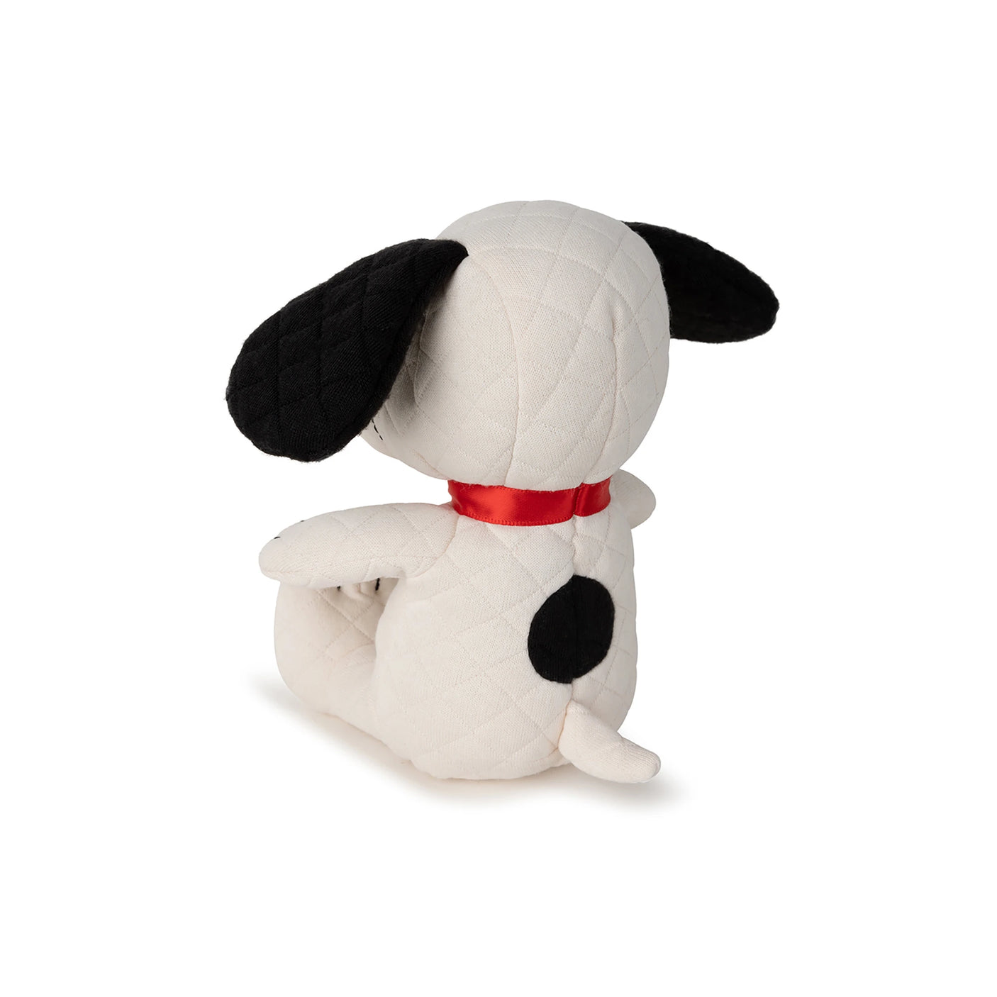 The Snoopy Quilted Plush in Gift Box by Snoopy boasts a delightful white quilted body, black ears, a unique black spot on its back, and a bright red collar. Ideal for any Peanuts enthusiast, this 17cm eco-friendly cuddle companion is crafted with care and precision.