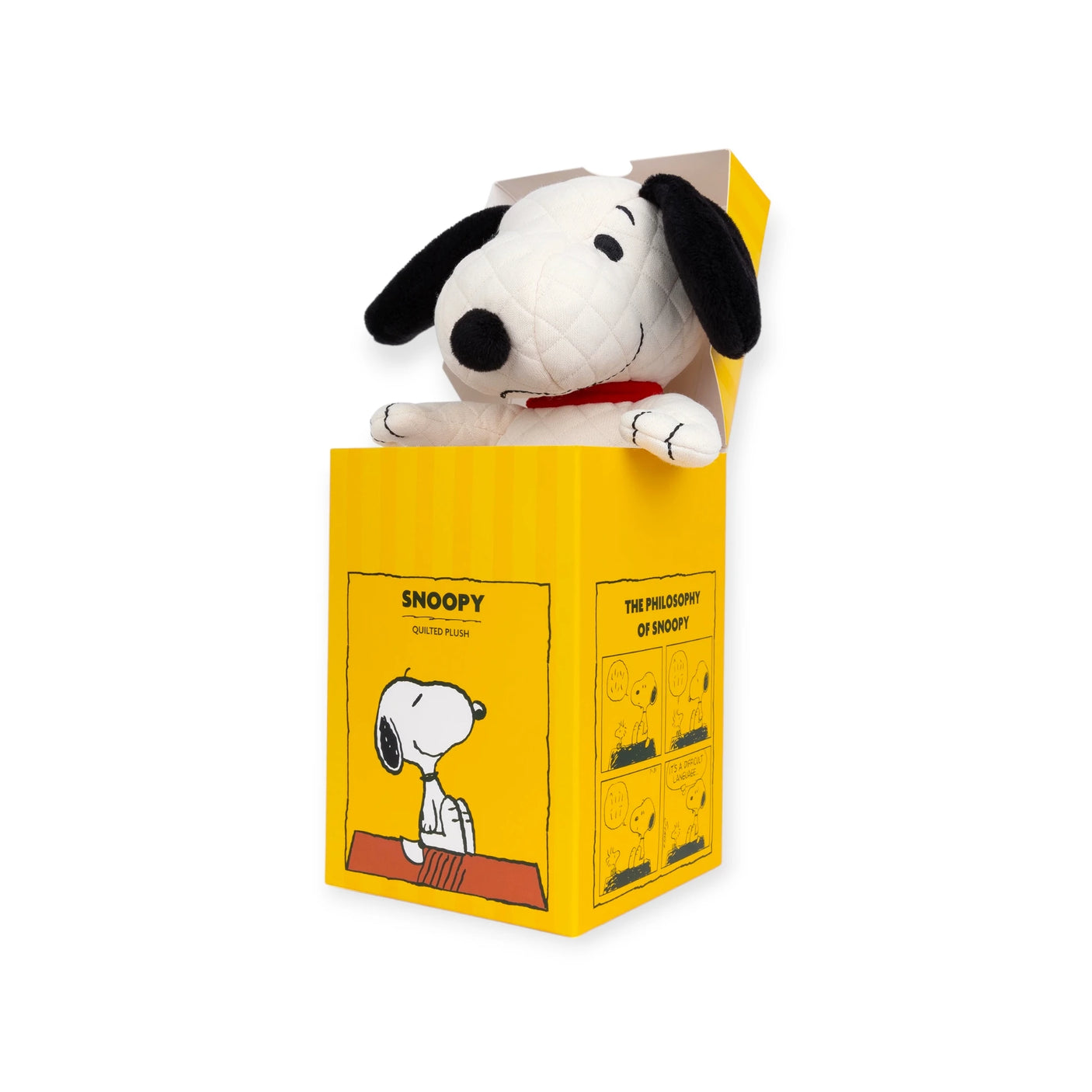 Discover the eco-friendly comfort of the Snoopy Quilted Plush in Gift Box – 17cm. Presented in an open yellow box featuring colorful Peanuts comic strip artwork, this plush toy is an ideal keepsake for any Peanuts enthusiast who cherishes both nostalgia and coziness.