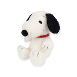 Introducing the Snoopy Plush Sitting 20cm - Terry Cream by Snoopy, a charming white dog with black ears and a red collar, seated in an upright position. Made from soft terry cloth and filled with recycled polyester, this eco-friendly cuddle companion is perfect for every Peanuts fan.