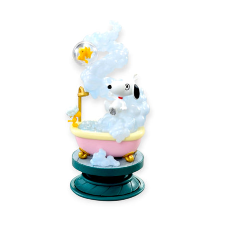 Snoopy and Woodstock in a bubbly bathtub scene with foam and shower on a rotating teal stand