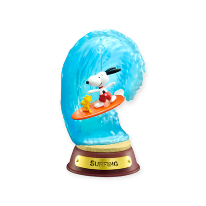 Swing ornament figurine surfing on a blue wave with starfish and Surfing base